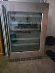 Thermador 24 Dual Zone Wine Refrigerator With Glass Door Open. Price: $1650.00.