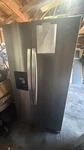 Whirlpool 36" Freestanding 24.6 Cu. Ft. Side By Refrigerator - WRS335SDHM Open. Price: $900.00.